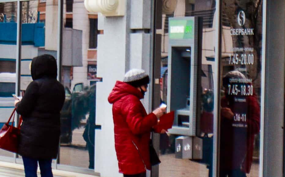 People queue at the cash machine of one of the branches of the Russian Sberbank bank in Tiraspol. People queue at the cash machine of one of the branches of the Russian Sberbank bank in Tiraspol.