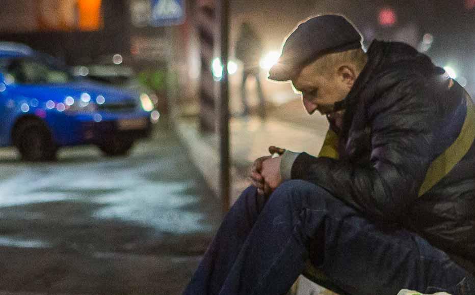 man sits in a parking lot in front of a closed shopping centre in Irpin, a town just beyond Kyiv’s city boundaries. (February 24, 2022) man sits in a parking lot in front of a closed shopping centre in Irpin, a town just beyond Kyiv’s city boundaries. (February 24, 2022)