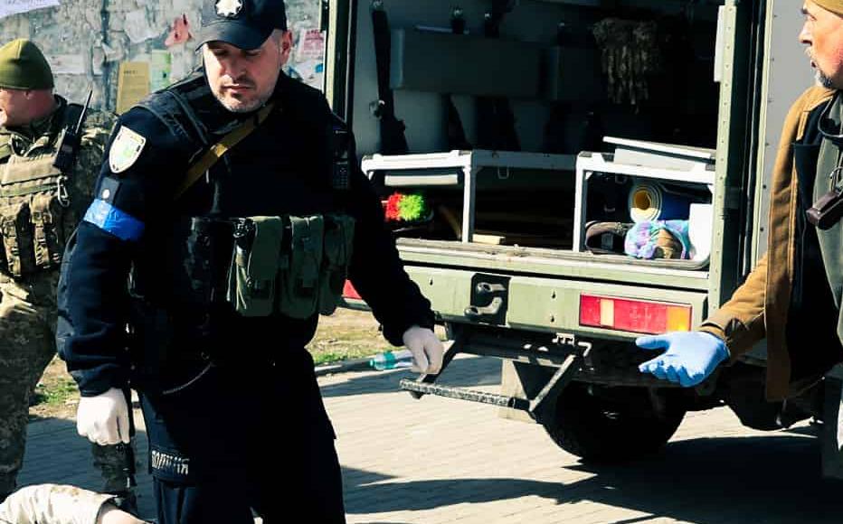 A military medic and police officers try to help people after a rocket attack on the railway station in Kramatorsk, a city with a pre-war population of 157,000, north of Donetsk, eastern Ukraine. A military medic and police officers try to help people after a rocket attack on the railway station in Kramatorsk, a city with a pre-war population of 157,000, north of Donetsk, eastern Ukraine.