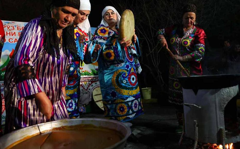 Women sell plates of sumalak at a Navruz fair in Dushanbe. Women sell plates of sumalak at a Navruz fair in Dushanbe.