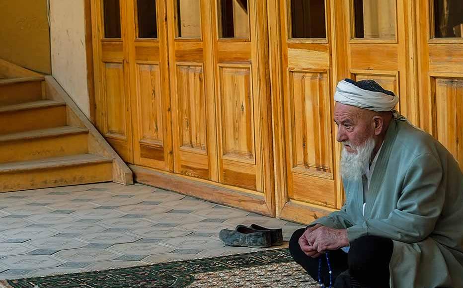 Men at the entrance of the mosque named after Muhammad Ibn Geloni. The mosque is not only a place for prayers, but a centre for the local community. Men at the entrance of the mosque named after Muhammad Ibn Geloni. The mosque is not only a place for prayers, but a centre for the local community.